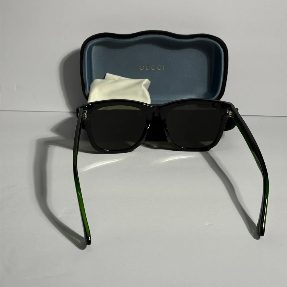 New Authentic GG0057SKN 002 Gucci Black Sunglasses with Green Lenses